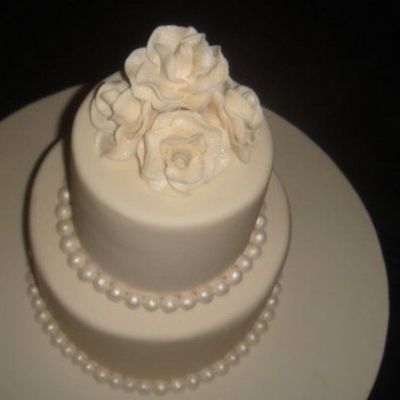 Ivory Wedding Cake With Roses And Pearls