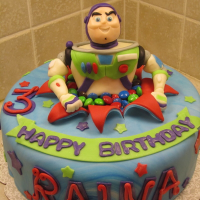 Buzz Lightyear Popping Out Of A Cake
