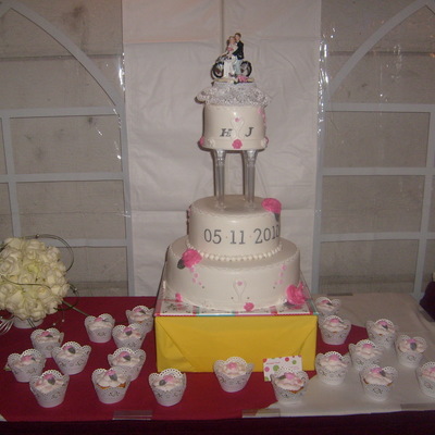 White Wedding Cake With Touch Of Pink And Silver