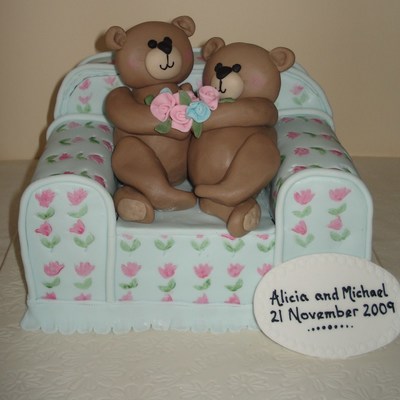 Teddies Cuddling On A Chair