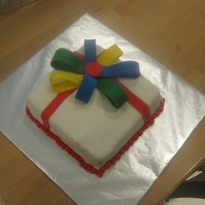 Present Wrapped With A Rainbow Bow