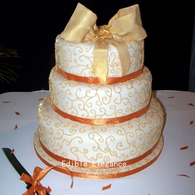 3 Tier Gold And Ivory Cake