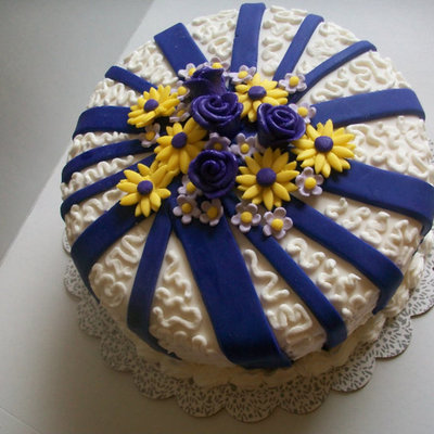 White, Yellow And Purple Flower Fondant Cake