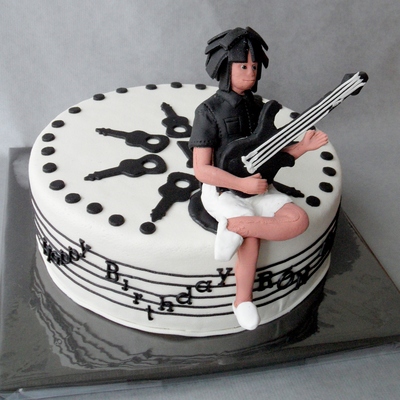 Music Cake With Relaxed Bass Guitar Player