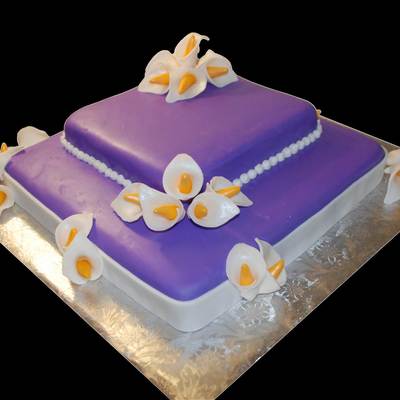 Purple Cake With White Calalillies