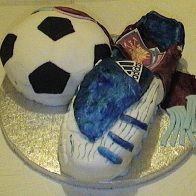 Football Boot And Football With Team Scarf