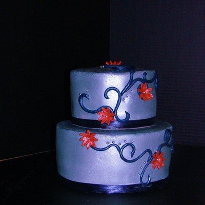 Daisy Blue Orange And Silver Wedding Cake