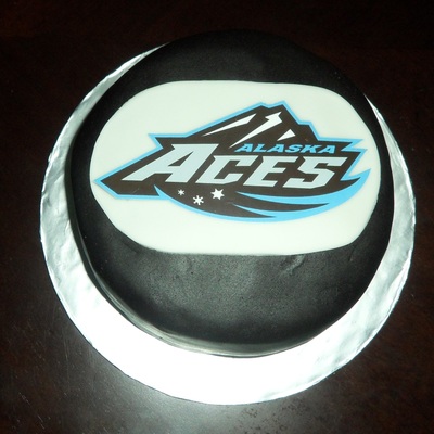 Aces Hockey Puck Cake