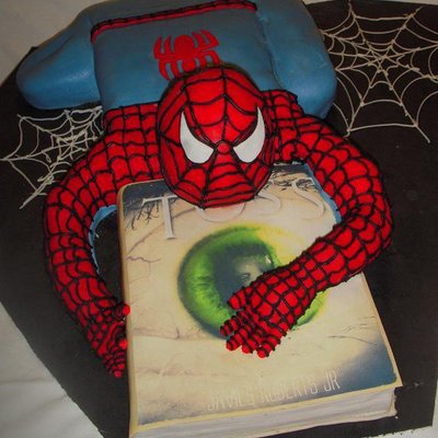 Spiderman Crawling Over A Book
