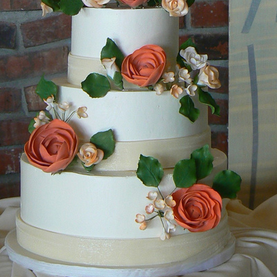 Roses And Blossoms On A Wedding Cake