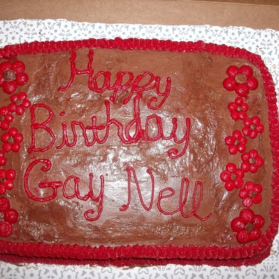 Red Flowers On Chocolate Frosting That I Made When I Was 17