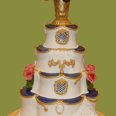 Elegant Wedding Cake With Blue And Gold Accents