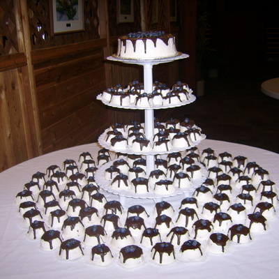 Mini Cakes With Drizzled Chocolate And Blueberries