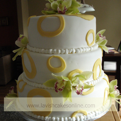 3 Tier Round With Green Orchids And Yellow Circles.