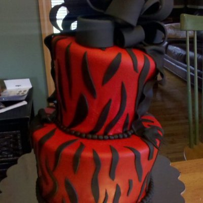Red And Black Topsy Turvy Zebra Cake With Bow