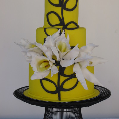 Yello And Black Cake With Sugar Cattleya Orchids