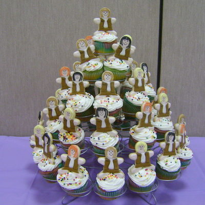 Rainbow Cupcakes With Girl Scout Cookies On Top.