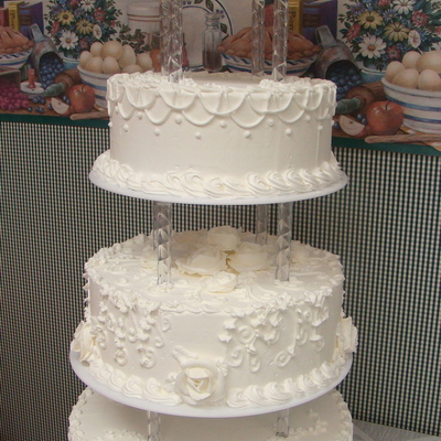 Four Tier Buttercream Wedding Cake With Stand