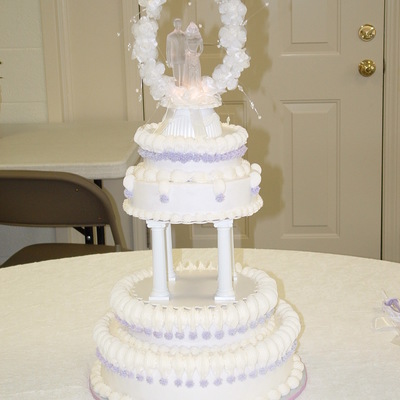 Round White Wedding Cake With Lavender Accents