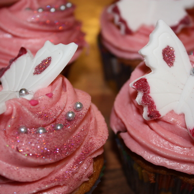 Strawberry Cupcakes And Icing With Painted Butterflies