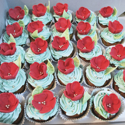 Pinacolada Cupcakes With Swiss Meringue Bc, Topped With Gumpaste Red Flowers