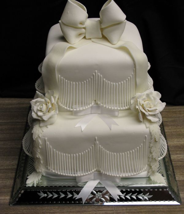 White On White Wedding Cake With Stringwork