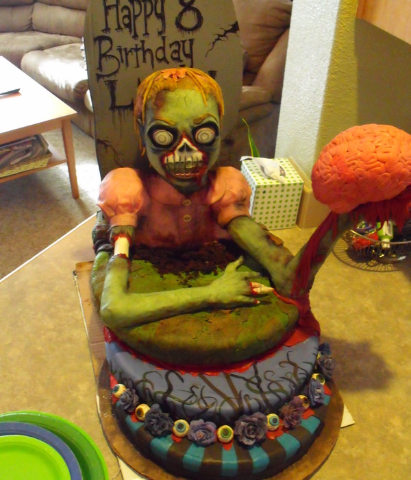 3-D Little Zombie Girl Holding Realistic Brain Cake