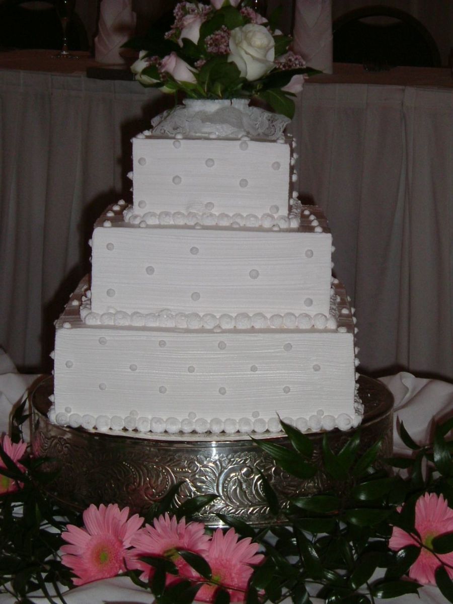 White Whipped Cream Wedding Cake With Whipped Cream Dots And Fresh