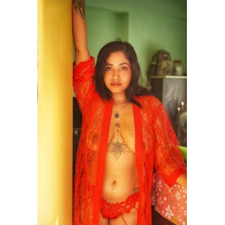 Yajnaseni posing almost topless in an orange lingerie showing big tits clearly through it