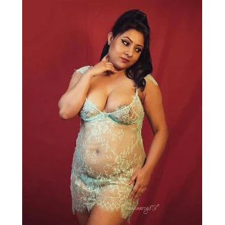 Sumana Sengupta shows glimpses of her big bosoms in a transparent green lingerie and panties