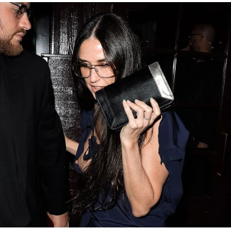 Demi Moore accidentally showing her nipples in an open dress