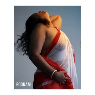 Delightful Desi MILF showing her topless big knockers in a wet transparent white and red braless saree