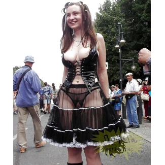In a transparent skirt and crotchless panties and showing her pussy