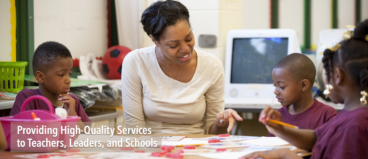 Photo of teacher and students