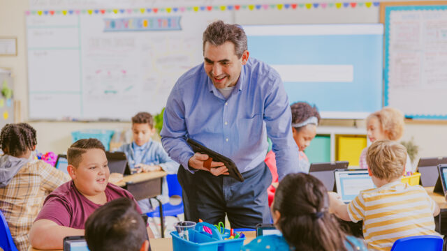 teacher with students in classroom