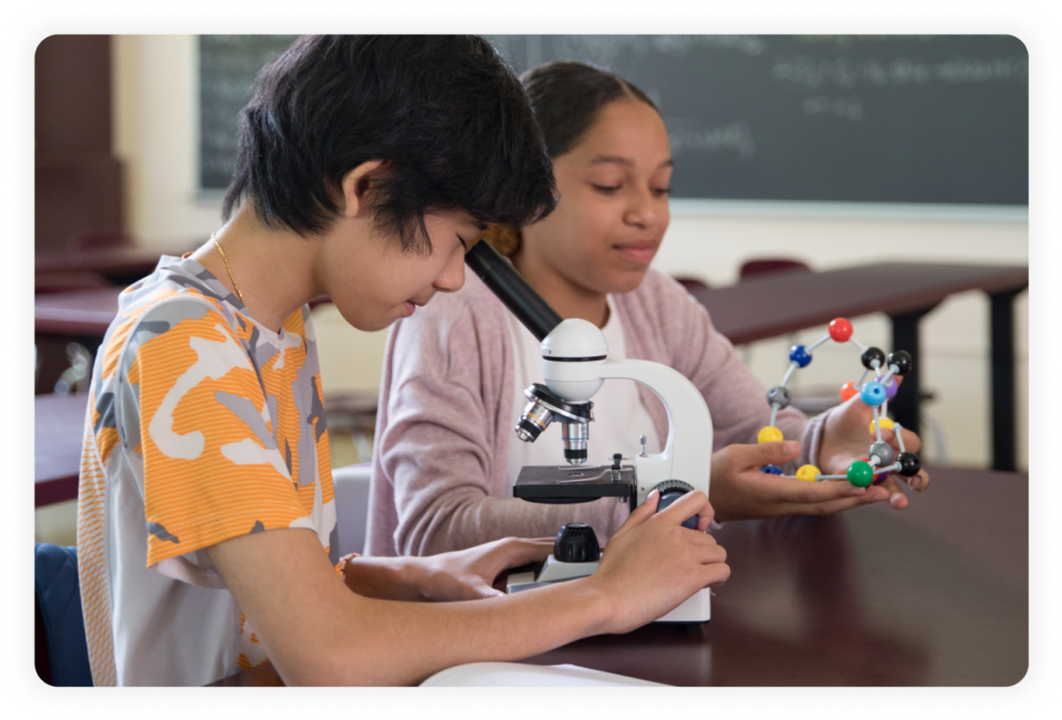student-looking-through-microscope-WF1836750