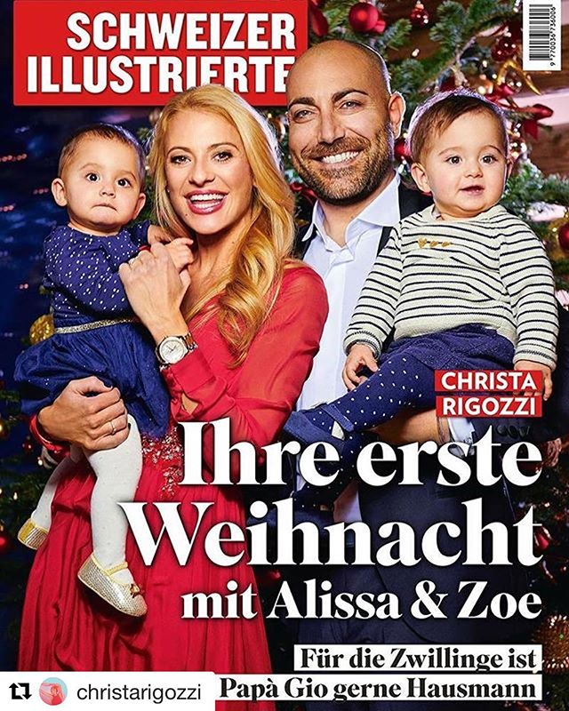 A family poses for a magazine cover celebrating their first Christmas with their twins.