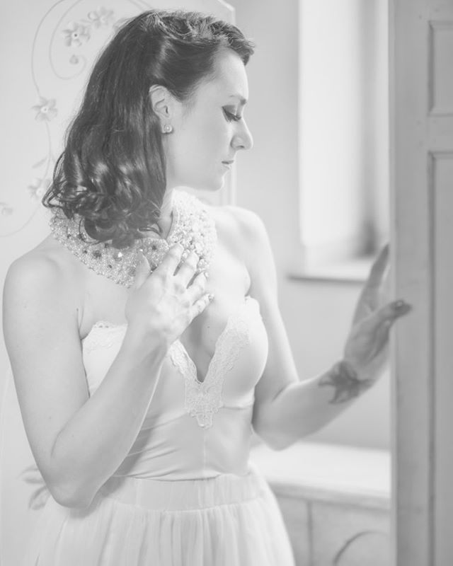 Elegant woman in vintage style with jewelry, a timeless portrait in monochrome tones.