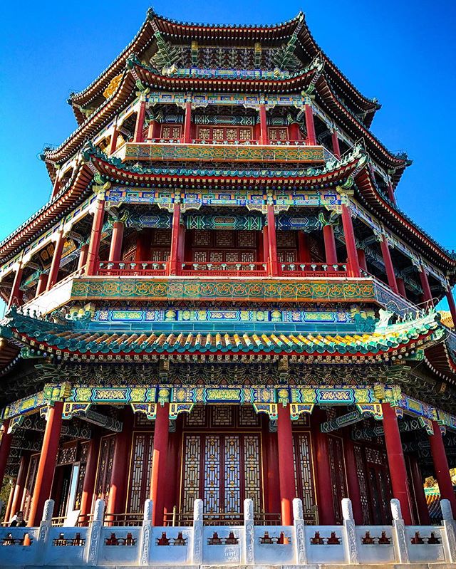 A vibrant pavilion in Beijing's Summer Palace showcases traditional Chinese architecture and serene beauty.