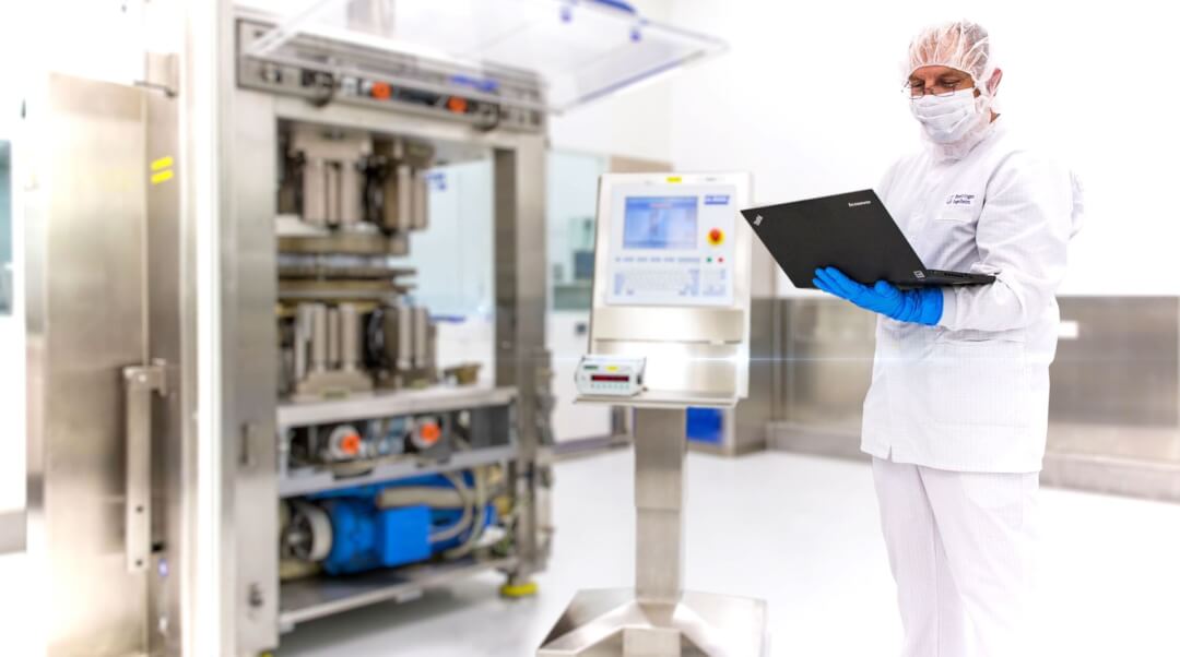 Worker Inspecting Equipment Cleanroom Laboratory