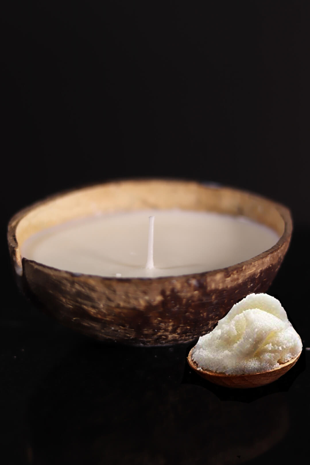 A coconut shell candle with coconut oil and wax is a natural and sustainable home fragrance for aromatherapy.