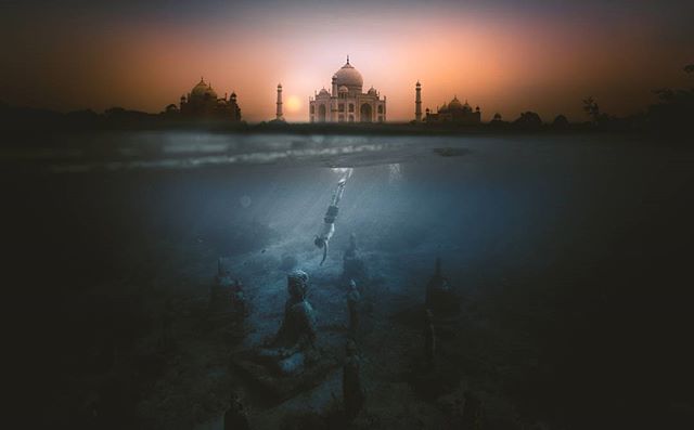 A diver explores underwater statues, with the Taj Mahal visible above the surface, blending history with adventure.
