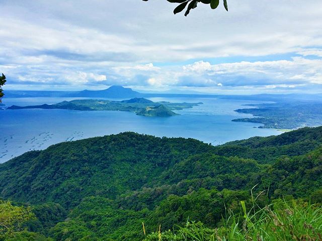 Panoramic view of Taal Volcano and lake in the Philippines. A serene landscape for travel and tourism campaigns.