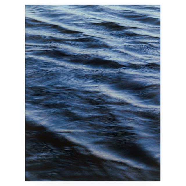 A serene, close-up view of gentle waves on the water's surface, creating a calming and natural background or visual element.