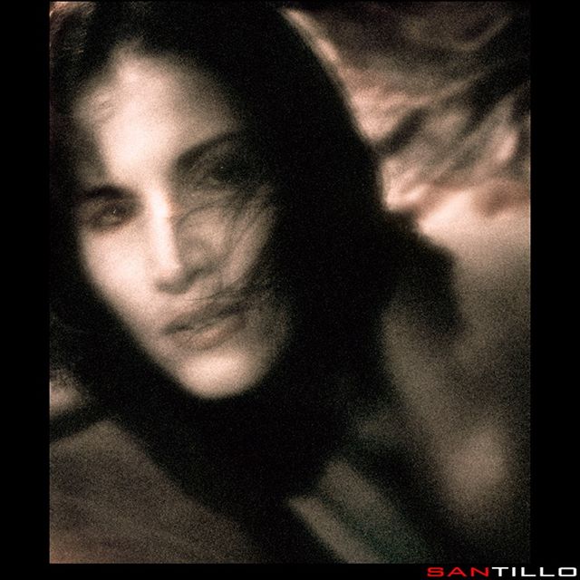 An artistic, vintage-style portrait of a woman evokes intimacy and a dreamy mood for lifestyle promotion.