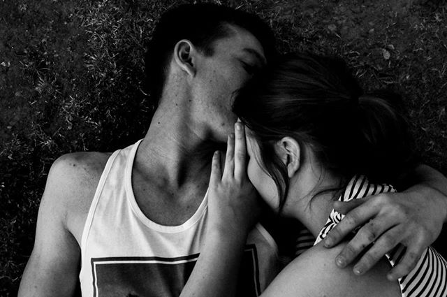 A loving couple embraces intimately, conveying tenderness and affection in a close-up shot.