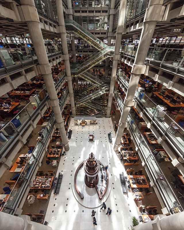 Interior view of the Lloyds building with multiple levels, escalators, and office spaces.