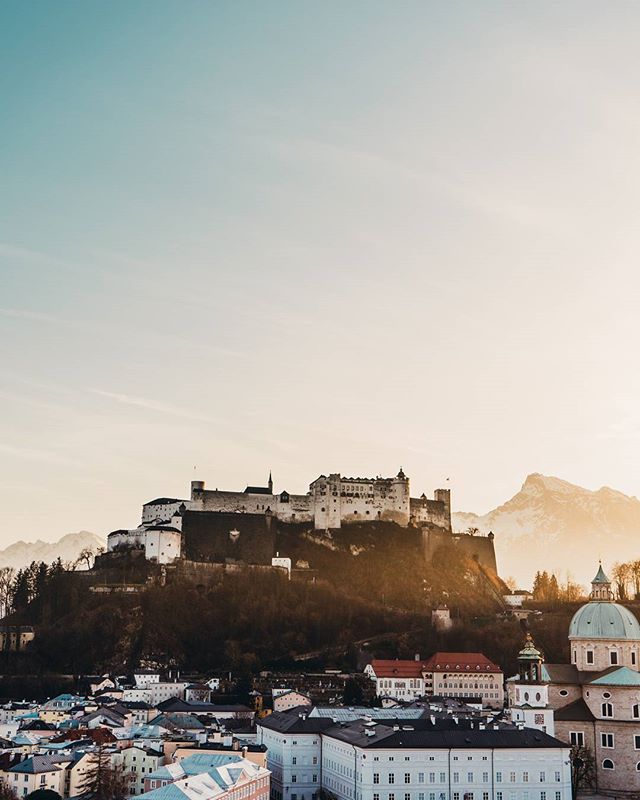 Scenic view of Hohensalzburg Fortress overlooking Salzburg, Austria, on a sunny day.