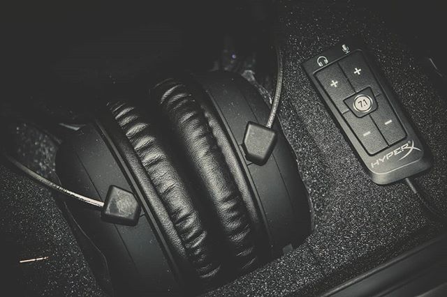 A close-up of HyperX headphones and volume control, perfect for gaming and professional audio setups.