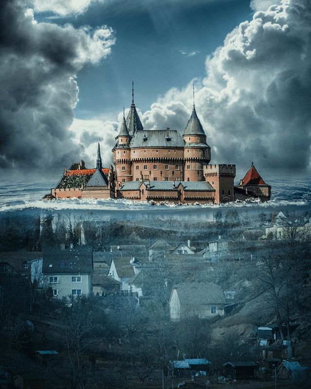 Surreal image of a castle seemingly floating above a town, blending fantasy with reality for a captivating visual experience.